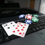 Laptop_with_poker_cards_and_poker_chips